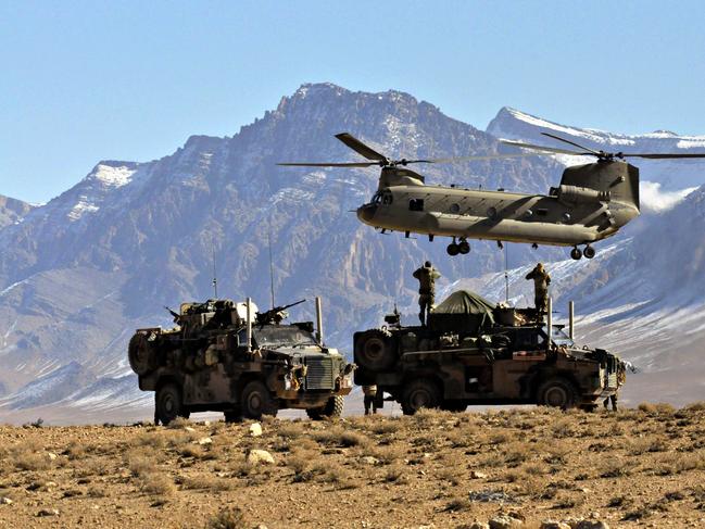 Members of the Special Operations Task Group await a resupply amid the rugged mountains of Oruzgan. Picture: Department of Defence