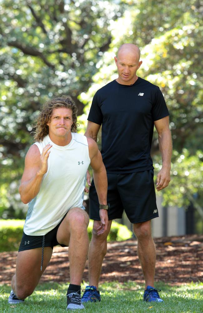 Adam McDougall putting with Nick Cummins thought a quick training session. Picture: John Fotiadis