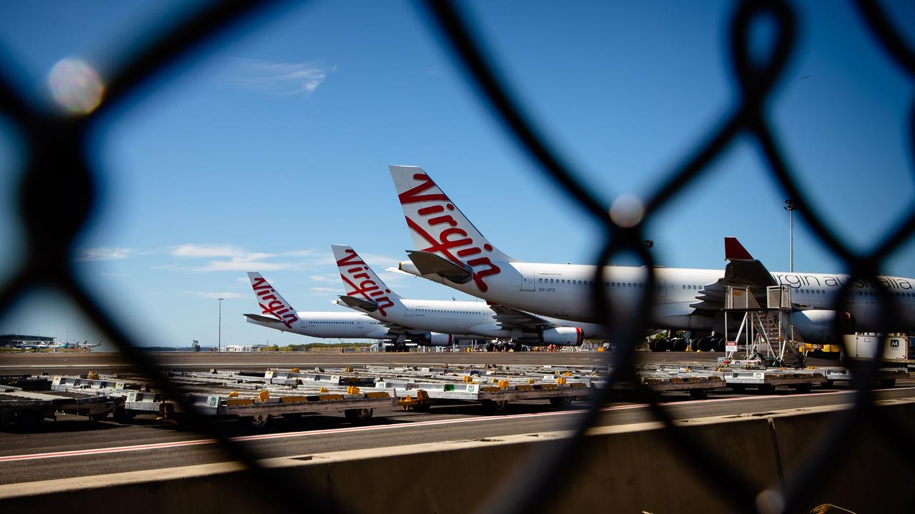 Virgin Australia aircraft parked on the tarmac at Brisbane Airport. Picture: Patrick Hamilton/AFP