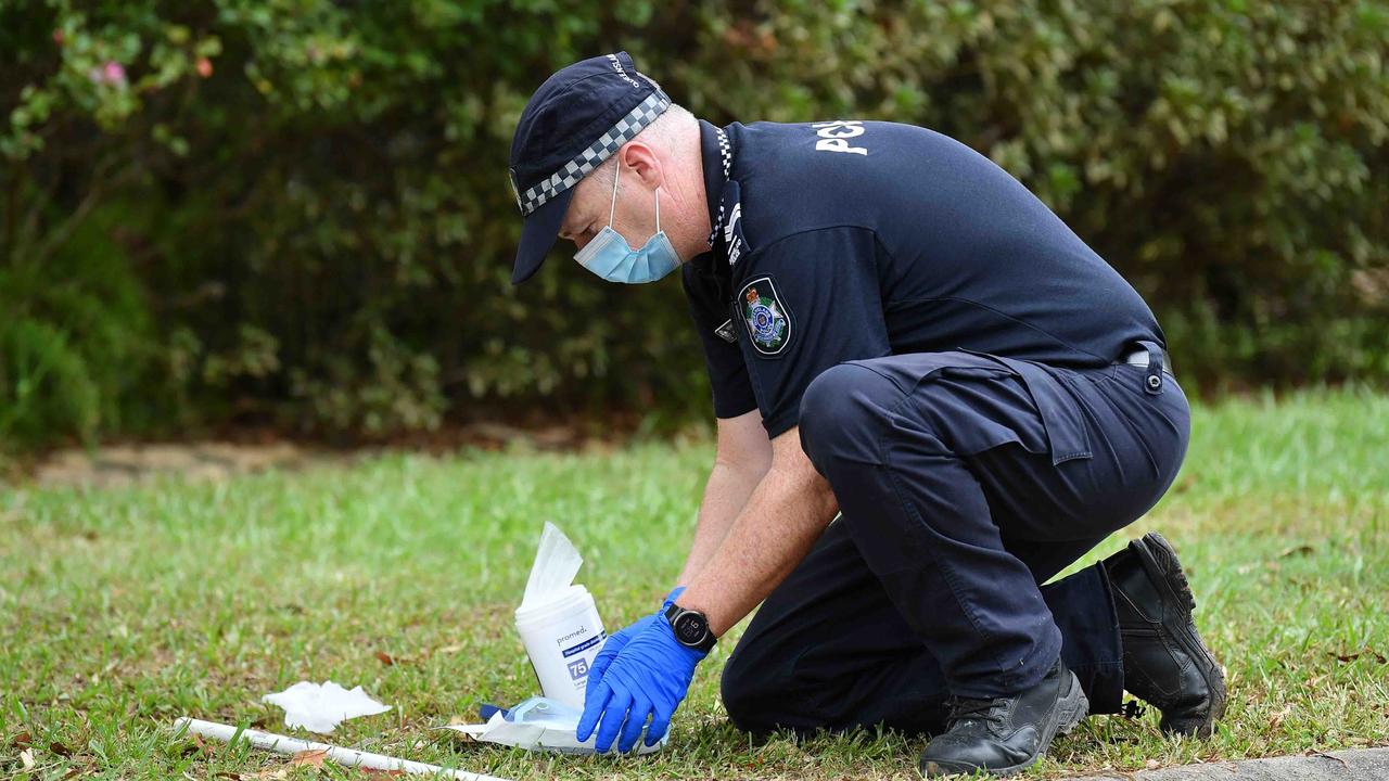 Police investigate the suspicious blaze. Picture: Patrick Woods.