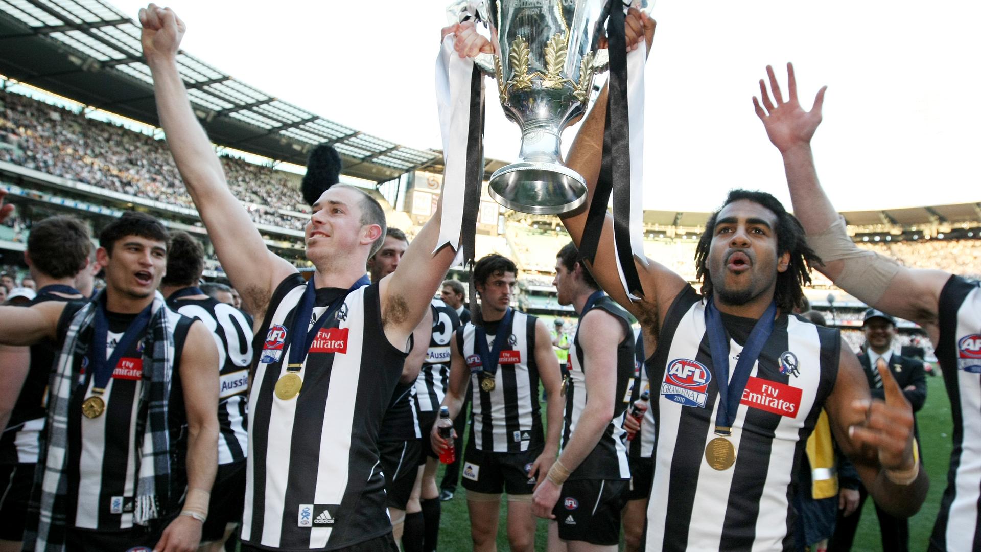 2010 Grand Final REPLAY. St Kilda v Collingwood. MCG. Players Nick Maxwell Harry O'Brien hold the premiership cup to supporters.