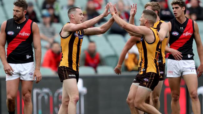 Tom Scully celebrates a goal while playing for the Hawks. Picture: Getty Images