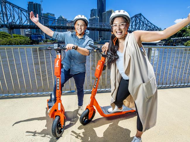 Lorenz Villalba from Bowen Hills and Jairaldine Cruz from Springfield on the way to Howard Smith Wharves by Neuron e-scooter on Brisbane Riverwalk, New Farm, Friday, October 28, 2022 - Picture: Richard Walker