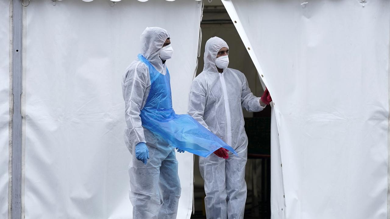 Volunteers at a temporary mortuary erected in the car park of a mosque in Birmingham, England.