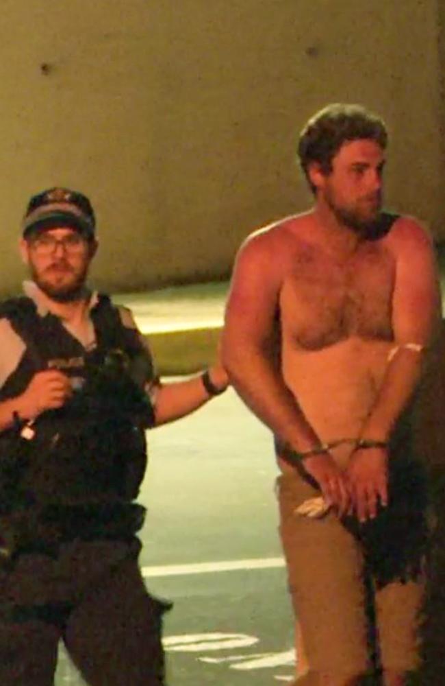 Accused... Samuel William Davidson, escorted by police, leaves Westmead hospital. Picture: 7 News