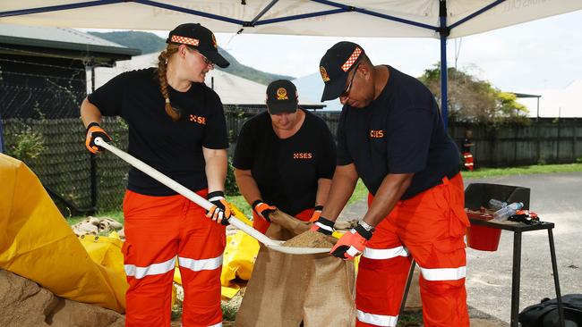 When Tropical Cyclone Owen loomed large over the Far North, with Cairns to face heavy rain Edmonton SES volunteers Lotus James, Kylie Maynard-Duff and John Lui filled sandbags to respond to calls from the southern Cairns region. FILE PICTURE: BRENDAN RADKE