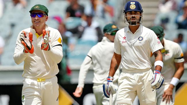 Brad Haddin sledges Virat Kohli at the MCG in 2014 Picture: Colleen Petch.