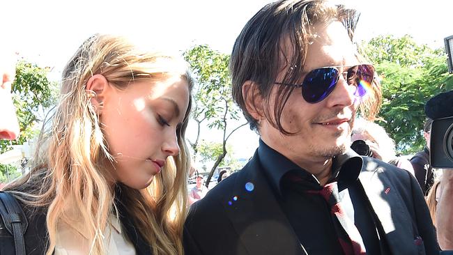 Amber Heard and Johnny Depp arrive at the Southport Magistrates Court on the Gold Coast. Picture: AAP.