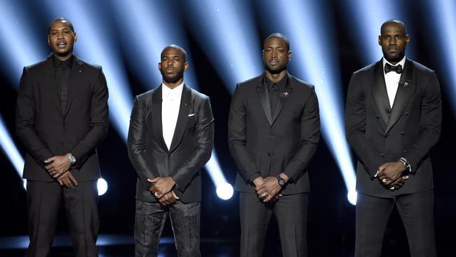 NBA basketball players Carmelo Anthony, from left, Chris Paul, Dwyane Wade and LeBron James speak on stage at the ESPY Awards.