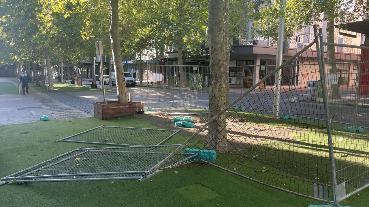 The wire fencing surrounding the site of the former timber deck in Little Malop St has been ripped down