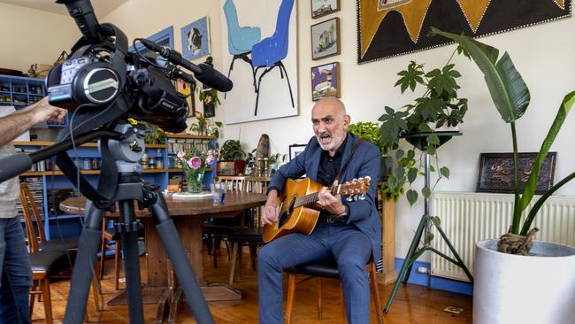 Paul Kelly performing one of three Christmas songs at his home in St Kilda, exclusively for The Australian. Picture: David Geraghty