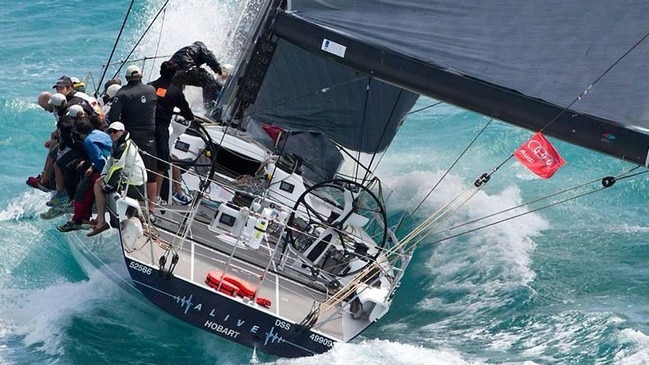 Racing yacht Alive powers through the water in the Sydney to Hobart Yacht Race.