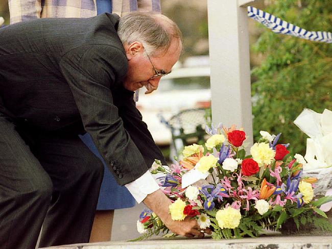 John Howard, instrumental in changing Australia’s gun laws, places a wreath at the steps of Broad Arrow cafe at Port Arthur. Picture: P/R Tasmania