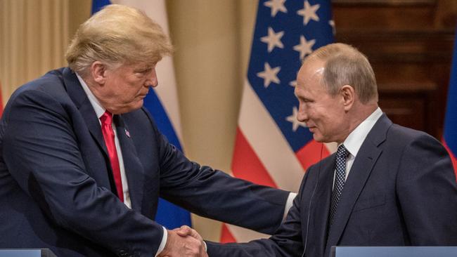 Donald Trump and Vladimir Putin shake hands in Helsinki. Picture: Getty Images