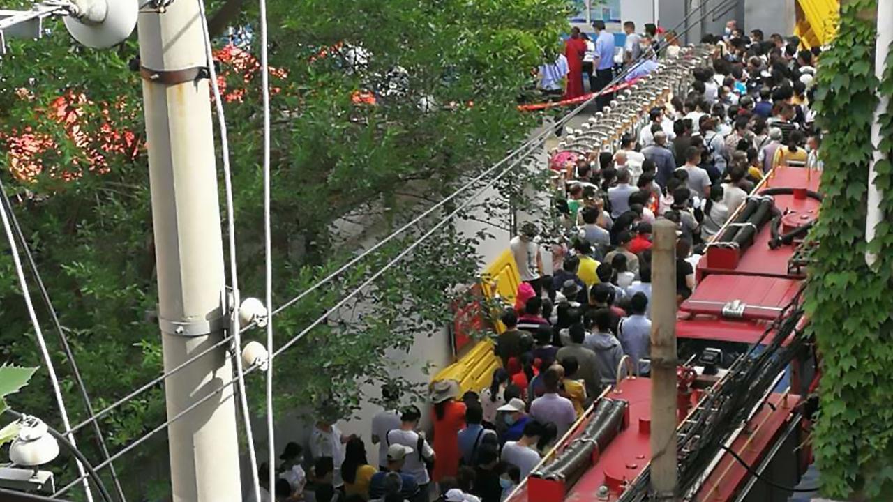 Wuhan residents ignore social distancing as thousands queue for COVID-19 tests on the day the city nearly doubled its daily testing figure to screen a staggering 856,128 people. Picture: Asiawire/australscope