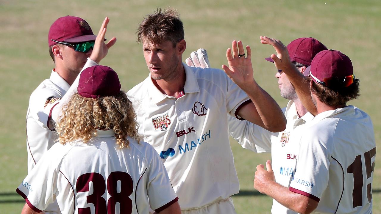 Cameron Gannon of Queensland is congratulated by teammates after dismissing Josh Nicholas of Western Australia (AAP Image/Richard Wainwright)