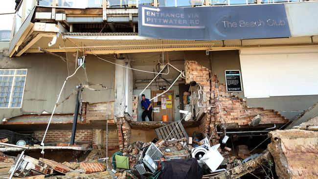 A man stands inside an area of The Beach Club at Collaroy that was severely damaged by the storm in June, 2016. Picture: AAP/David Moir