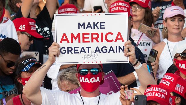 Supporters of US President Donald Trump attend a Make America Great Again rally as he campaigns in Sanford, Florida. Picture: AFP