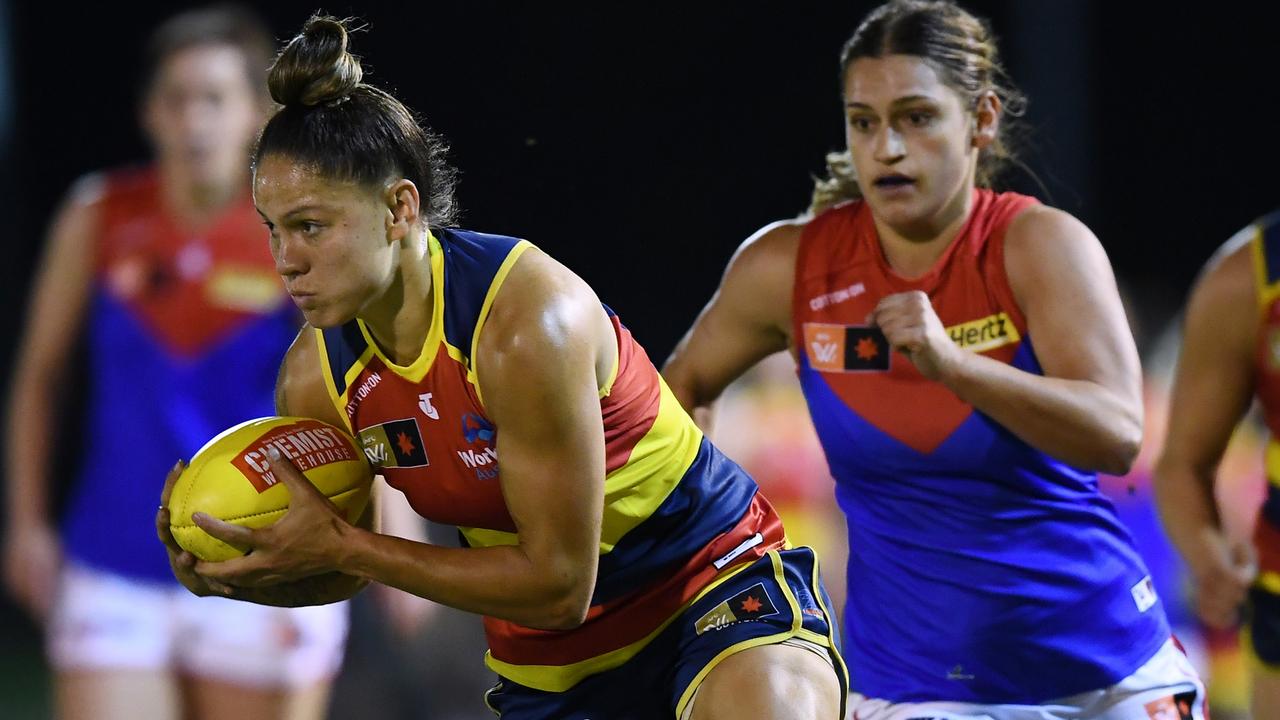 Stevie-Lee Thompson of the Adelaide Crows gets away from Eliza West of the Demons during the round one AFLW match. Picture: Mark Brake/Getty Images