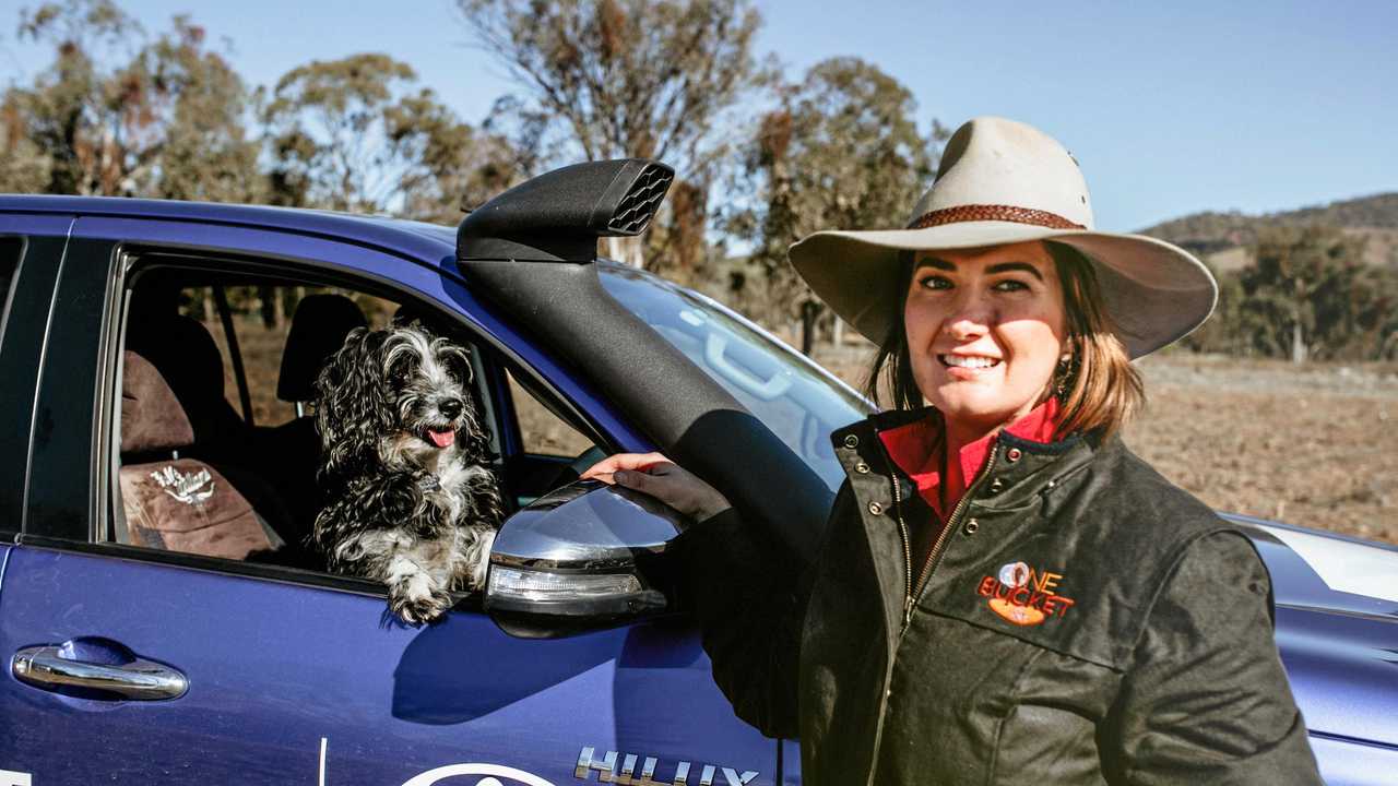 ON THE ROAD: Photographer Edwina Robertson and her dog, Jordie, are spreading awareness of drought-stricken communities. Picture: Edwina Robertson