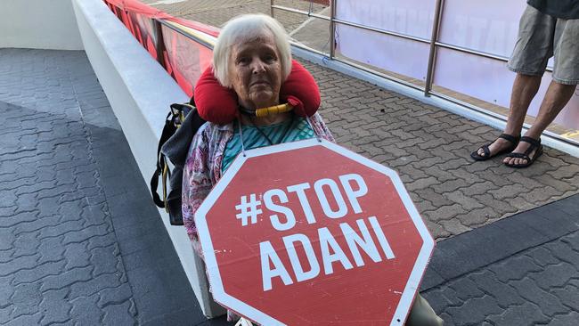 Barb Nielsen, 75, locked herself to a handrail by her neck outside of the Adani headquarters in Townsville.