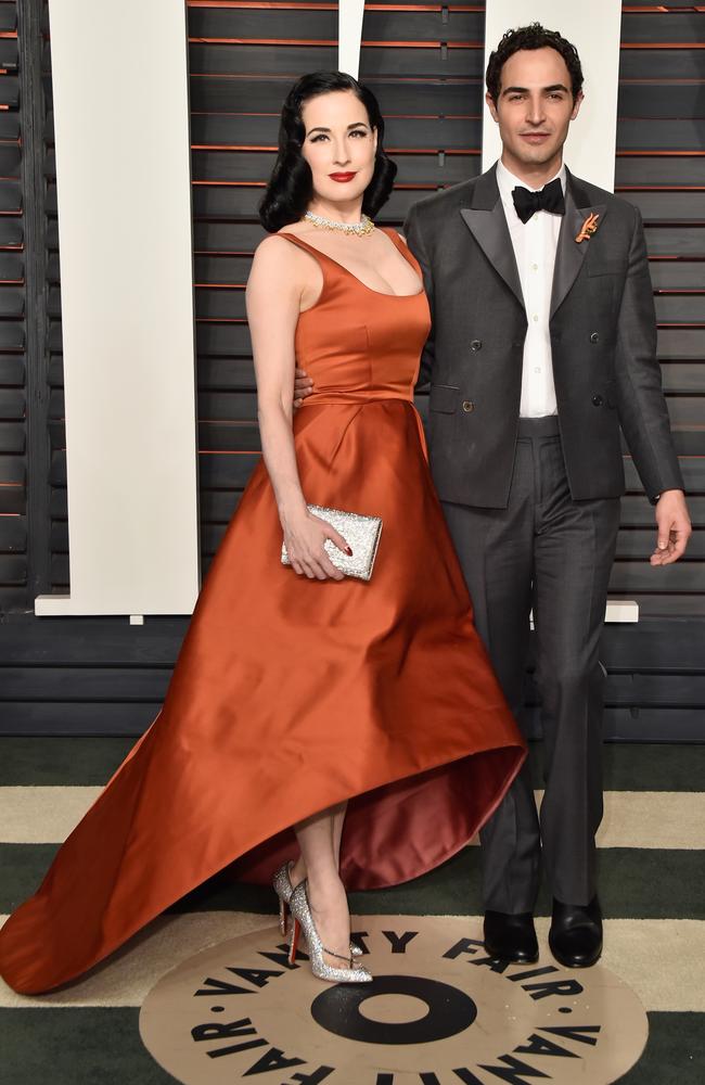 Dancer/model Dita Von Teese (L) and fashion designer Zac Posen attend the 2016 Vanity Fair Oscar Party. (Photo by Pascal Le Segretain/Getty Images)