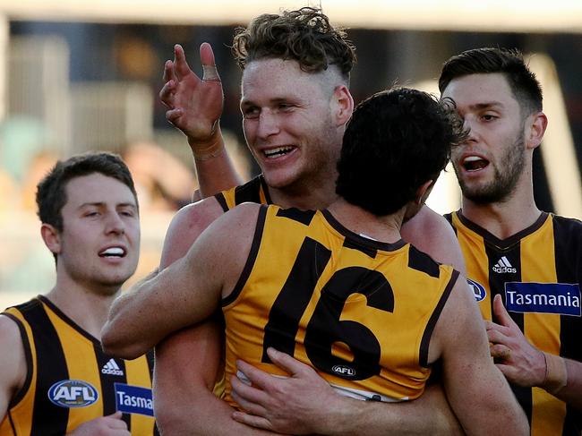 Luke Lowden celebrating one of his three goals with teammates.