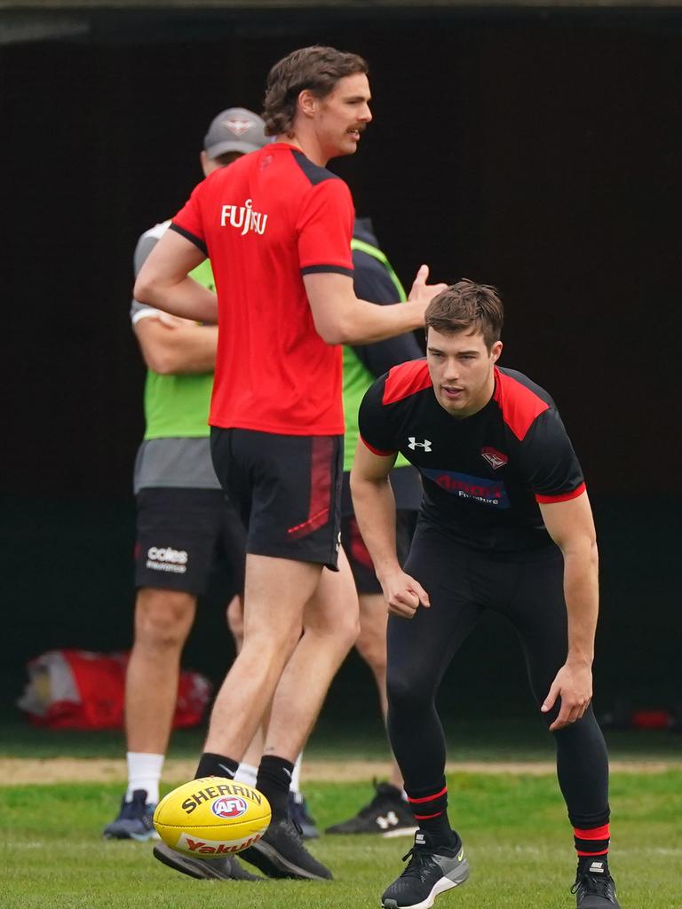 Daniher and Merrett at an Essendon training session.