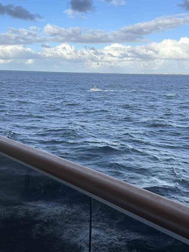 Police boats circle amid a frantic search and rescue off Sydney.