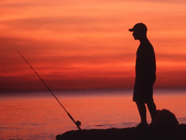 <s1>A fisherman gets into the spirit of social distancing at Fannie Bay. Picture: Glenn Campbell</s1>