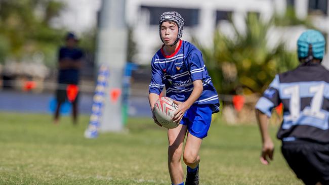 Day One of King of the Country rugby tournament at James Overell Park, Southport. Maroochydore Swans U14s' ( big stripes - blue) in action against USQ Saints U14s' (darker blue small stripes). USQ Saints U14's Harry McMillan . Picture: Jerad Williams
