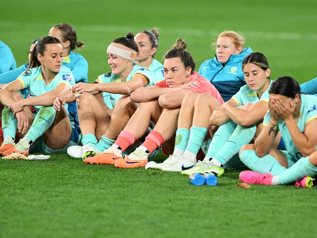 Australian players watch on during Sweden’s medal presentation. Picture: Bradley Kanaris/Getty Images.