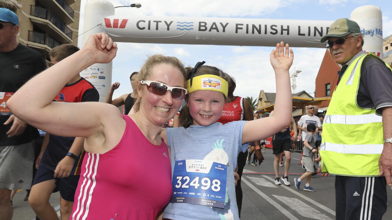 Six year old Natalie Hughes ran the 6 km with her mum Sarah Hughes from Mt Gambier. Picture: Dean Martin/AAP