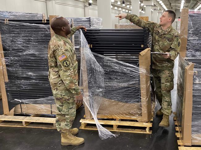 US National Guard Soldiers unpack inventory for a makeshift hospital at New York’s Javitts Centre. Picture: AFP