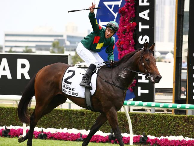 Jockey Ryan Maloney celebrates after riding Alligator Blood to victory in race 6, the Magic Millions 3YO Guineas, during Magic Millions Race Day at Aquis Park on the Gold Coast. Saturday, January 11, 2020. (AAP Image/Jono Searle) NO ARCHIVING, EDITORIAL USE ONLY