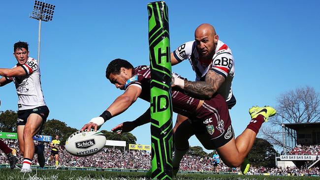 Manly's Matthew Wright scores a try in the corner under pressure from the Roosters' Blake Ferguson. Picture: Phil Hillyard