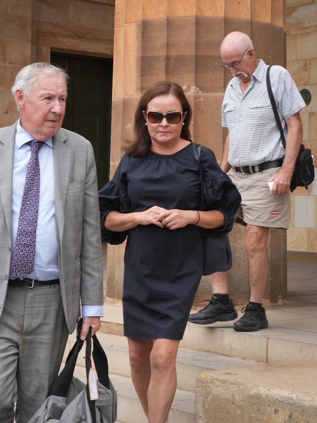 Former teacher Katherine Baird leaving Adelaide Magistrates Court on Tuesday with her lawyer Stephen Ey. Picture: Dean Martin