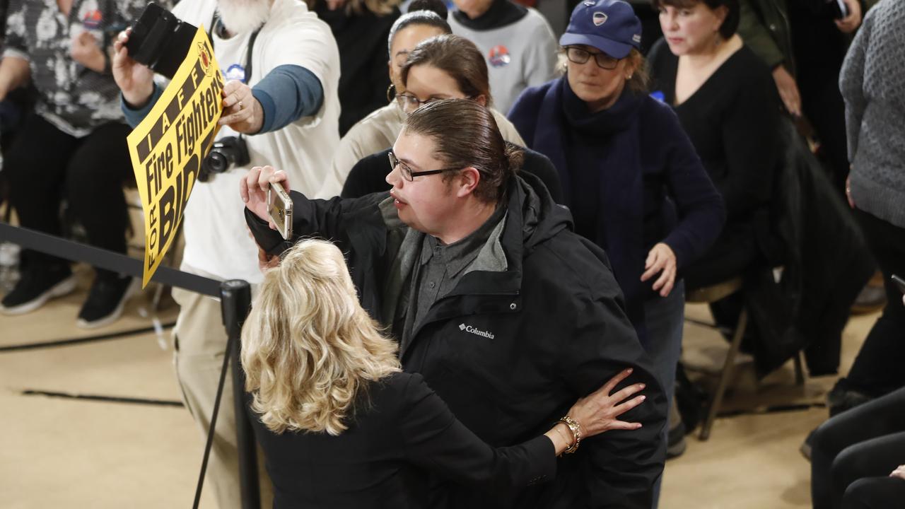 Jill Biden steps in to escort an unidentified heckler, centre, off the premises after he attempted to interrupt her husband’s campaign event. Picture: Pablo Martinez Monsivais/AP