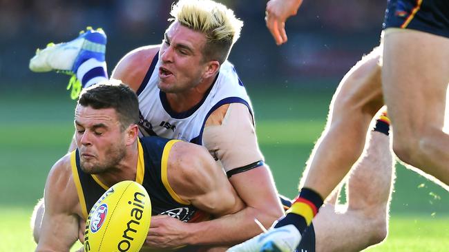 Luke Ryan crunches Adelaide’s Brad Crouch.