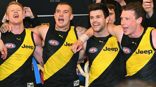 Josh Caddy, Dustin Martin, Trent Cotchin and Dylan Grimes celebrate their qualifying final win.