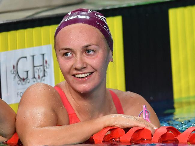 Ariarne Titmus (right) is seen celebrating after winning the final of the womens 800 metre Freestyle during day three of the 2018 Australian Swimming Trials at the Gold Coast Aquatic Centre at Southport on the Gold Coast, Friday, March 2, 2018. (AAP Image/Darren England) NO ARCHIVING, EDITORIAL USE ONLY