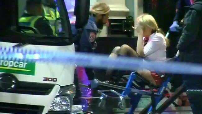 Ms Sukys is treated by paramedics outside Inflation nightclub following the shooting.