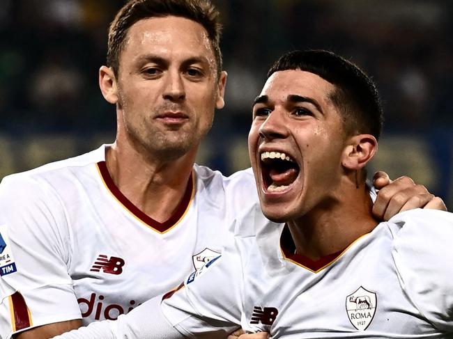 A Romaâs Italian forward Cristian Volpato (R) celebrates after he scored a second goal for his team during the Italian Serie A football match between Hellas Verona and AS Roma at the âMarcantonio Bentegodi Stadiumâ in Verona on October 31, 2022. (Photo by MARCO BERTORELLO / AFP)