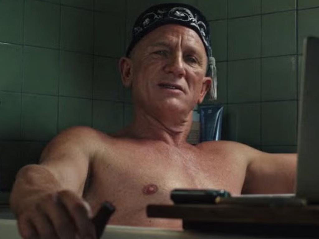 Book just out of shot ... Daniel Craig in bath from Glass Onion: A Knives Out Sequel. Netflix