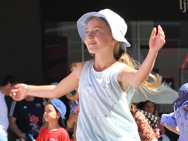 A young girl throws some moves