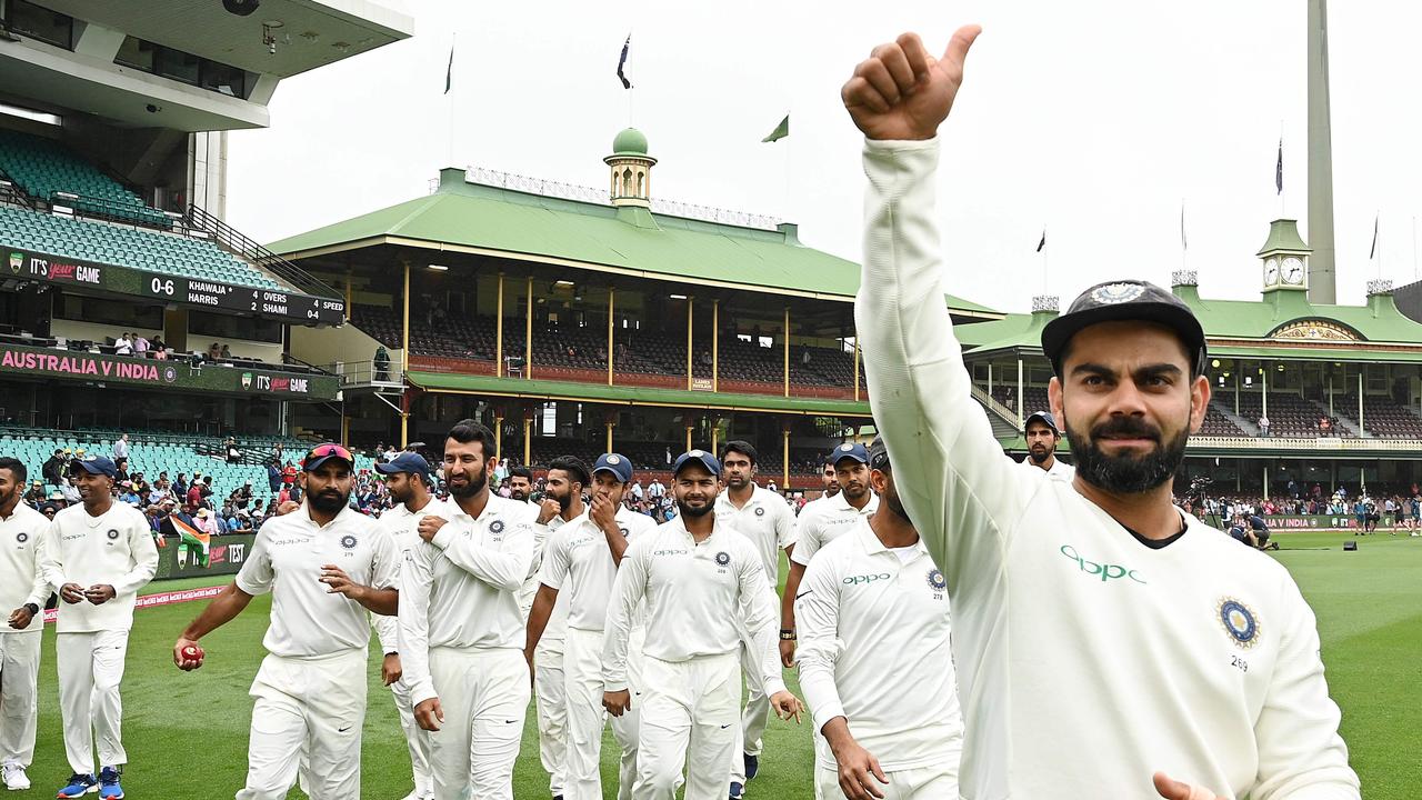 India captain Virat Kohli gestures as the India team celebrates their series win on the last tour of Australia. Picture: Peter Parks / AFP