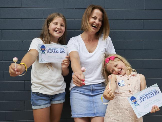 Amelia, 10, with mum, Anne-Marie Packer and sister, Georgia, 5 at the vaccination clinic in Enfield, on the first day that children between 5-11 can receive the COVID-19 vaccine, Monday, Jan. 10, 2022. Picture: MATT LOXTON