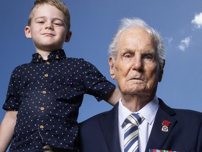 World War II Veteran Jim Grebert who served in the 58th Infantry Battalion in New Guinea and Bougainvile pictured with his 4 year old great great grandson Connor at Sandgate where he be participating in the Anzac March proceedings on Tuesday. Picture Lachie Millard