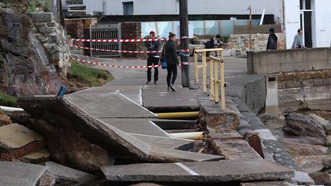 Walkers and runners have been ignoring the safety tape meant to stop people accessing the damaged Manly-to-Shelly footpath. Picture: Lee Godtchalk