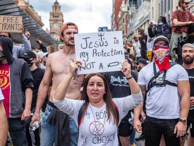 Protesters held signs and chanted during the rally in Melbourne’s CBD. Picture: Sarah Matray